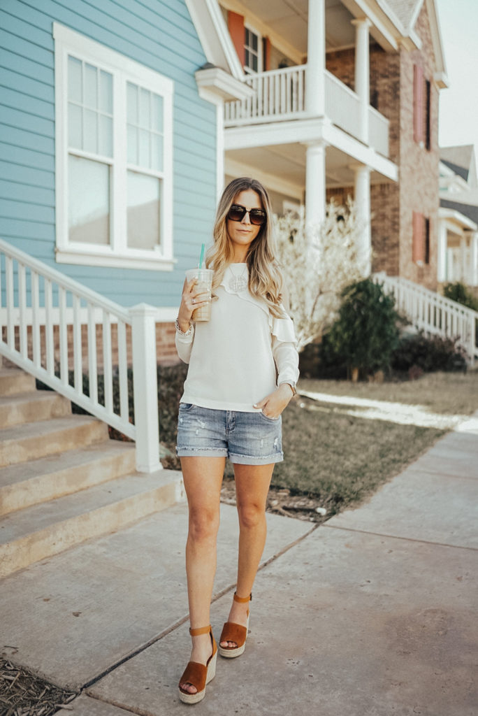 The easiest spring outfit to recreate! A lightweight top with cold shoulders, shorts that are long enough for moms but still trendy and a pair of sandals. Sandals are the dupes for Marc Fisher sandals but are $100 less! Get $10 off right now - Click through to see more, plus what my favorite #starbucks drinks are and what I'm currently listening to on my spring playlist! Visit https://ashleenichols.com// to read more!